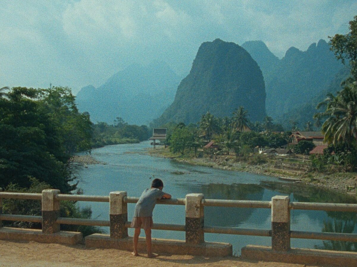 The main entrance of Chapter in the distance, with some plants in the foreground.